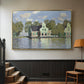 Gold floater framed canvas featuring a waterfront architecture with still reflections, displayed in a hallway near a staircase.