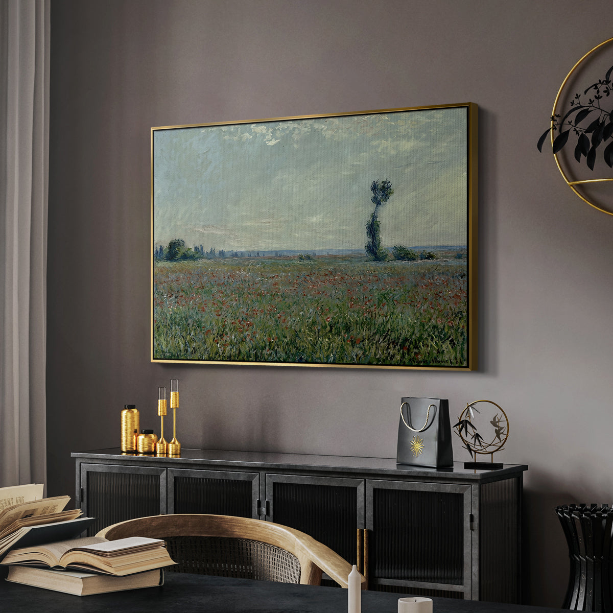 Poppy Field, 1881 by Claude Monet in a gold floater framed canvas featuring a rural meadow with scattered poppies and soft horizon, displayed above a desk in a dark home office interior.