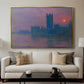 The Houses of Parliament, Sunset, 1903 by Claude Monet displayed in a gold floater framed canvas above a sofa in a clean living room.