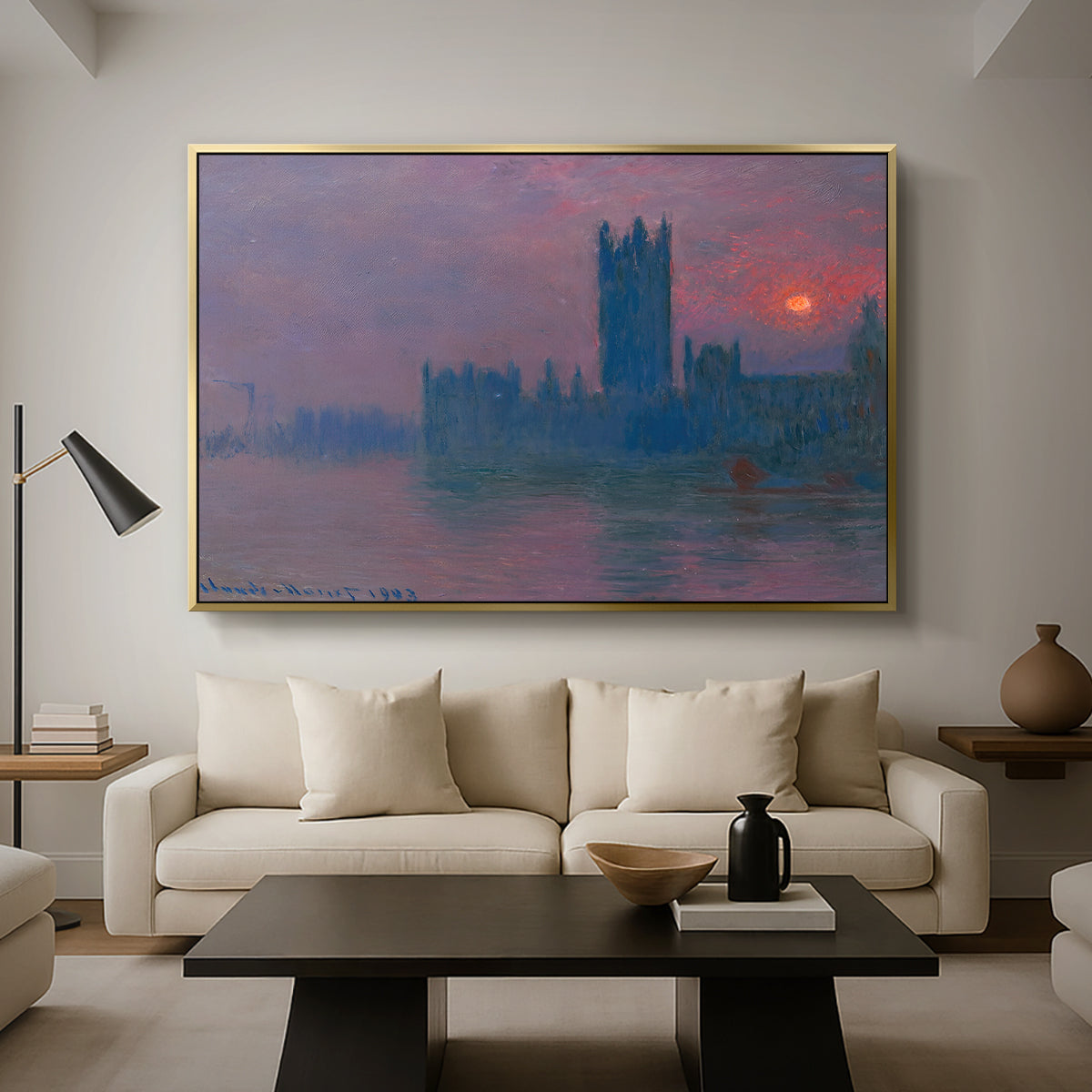 The Houses of Parliament, Sunset, 1903 by Claude Monet as a gold floater framed canvas featuring a silhouette of Parliament buildings against glowing sunset across river, displayed above a sofa in a modern living room.
