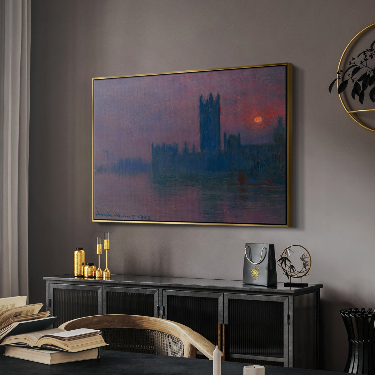 The Houses of Parliament, Sunset, 1903 by Claude Monet in a gold floater framed canvas featuring an atmospheric London scene with buildings fading into haze, displayed above a desk in a dark home office interior.