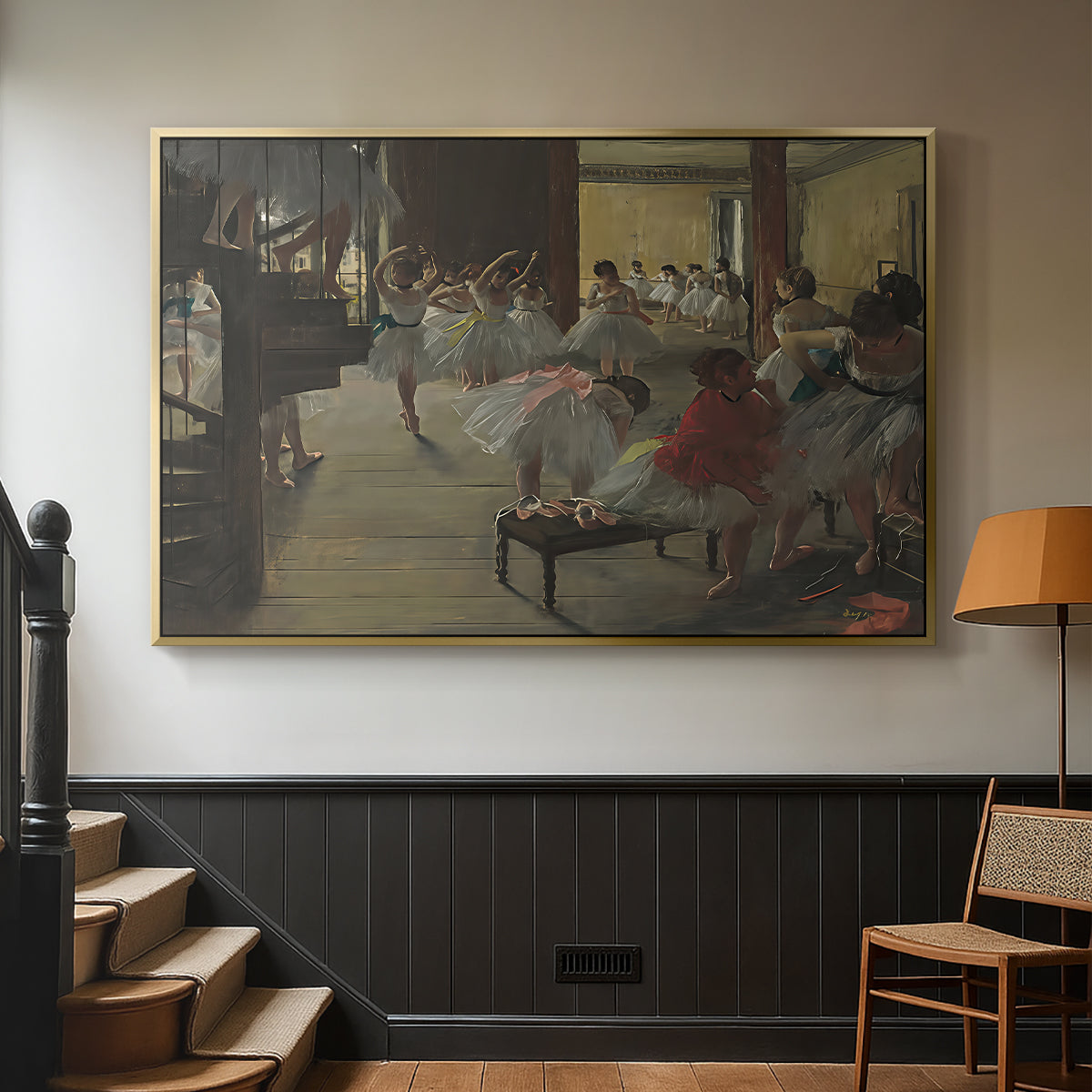 Gold floater framed canvas featuring a group of dancers preparing during class with natural light, displayed in a hallway near a staircase.
