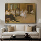 The Dancing Class, c. 1870 by Edgar Degas displayed in a gold floater framed canvas above a sofa in a clean living room.