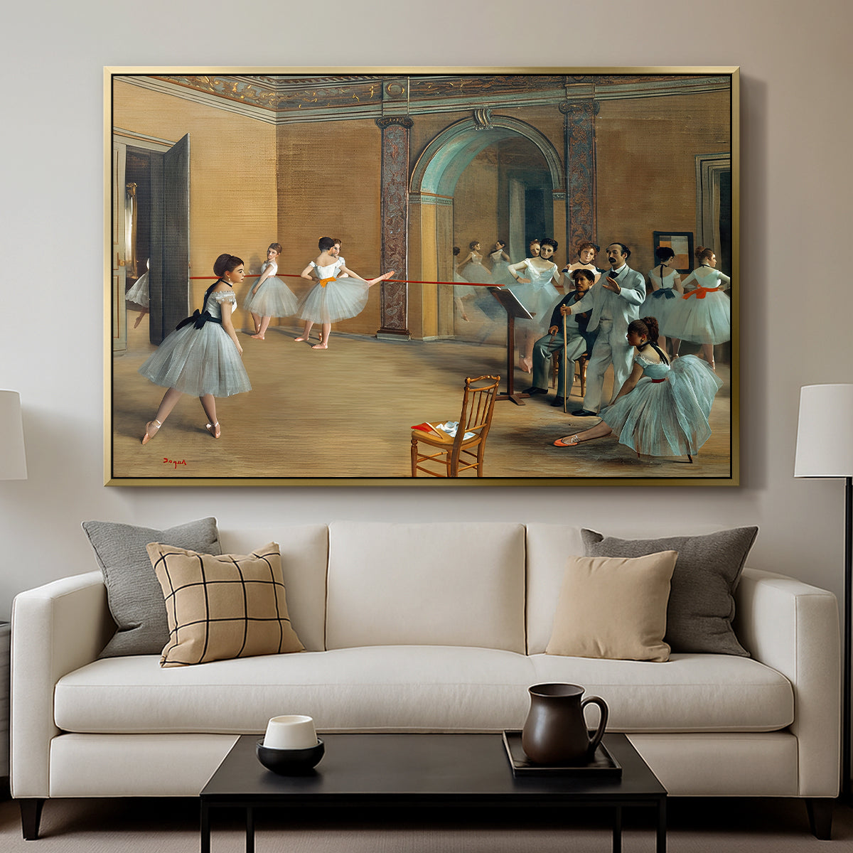 The Dance Foyer at the Opera on the Rue Le Peletier, 1872 by Edgar Degas displayed in a gold floater framed canvas above a sofa in a clean living room.