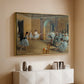 Gold floater framed canvas of The Dance Foyer at the Opera on the Rue Le Peletier, 1872 by Edgar Degas, featuring an interior scene of dancers waiting and stretching in large studio above a console cabinet in a minimalist entryway.
