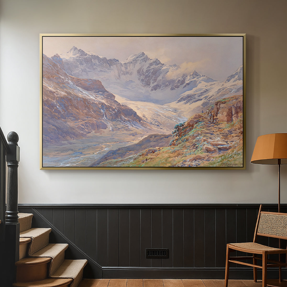 Gold floater framed canvas featuring an expansive alpine view with ice and distant mountains, displayed in a hallway near a staircase.
