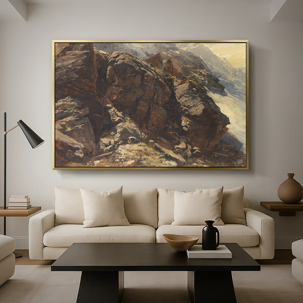High Mountain Study, c. 1870 by Edward Theodore Compton as a gold floater framed canvas featuring a rocky alpine terrain with steep slopes and distant mountain peaks, displayed above a sofa in a modern living room.