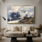The Grossglockner, 1880 by Edward Theodore Compton as a gold floater framed canvas featuring a towering mountain peak rising above rocky alpine landscape, displayed above a sofa in a modern living room.