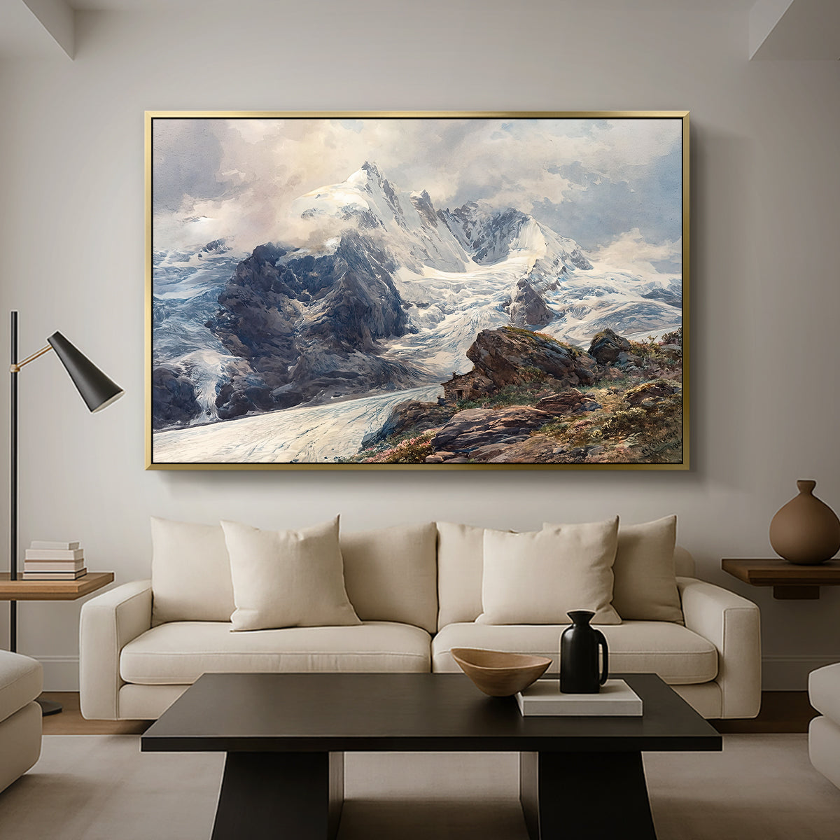 The Grossglockner, 1880 by Edward Theodore Compton as a gold floater framed canvas featuring a towering mountain peak rising above rocky alpine landscape, displayed above a sofa in a modern living room.