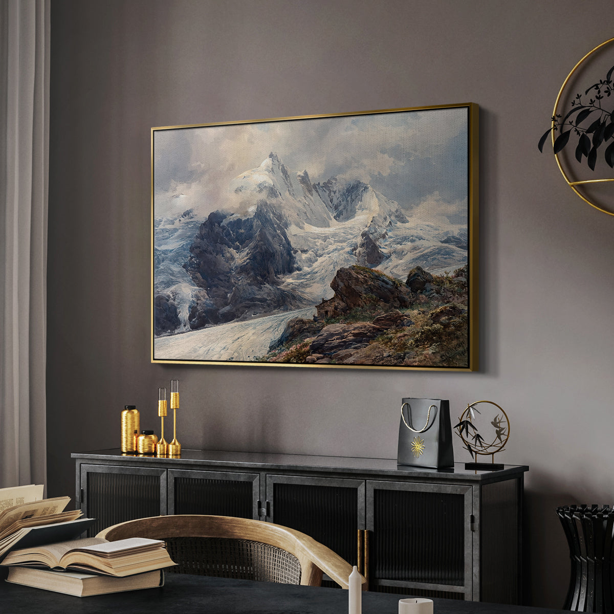 The Grossglockner, 1880 by Edward Theodore Compton in a gold floater framed canvas featuring a realistic landscape of high mountain under open sky, displayed above a desk in a dark home office interior.