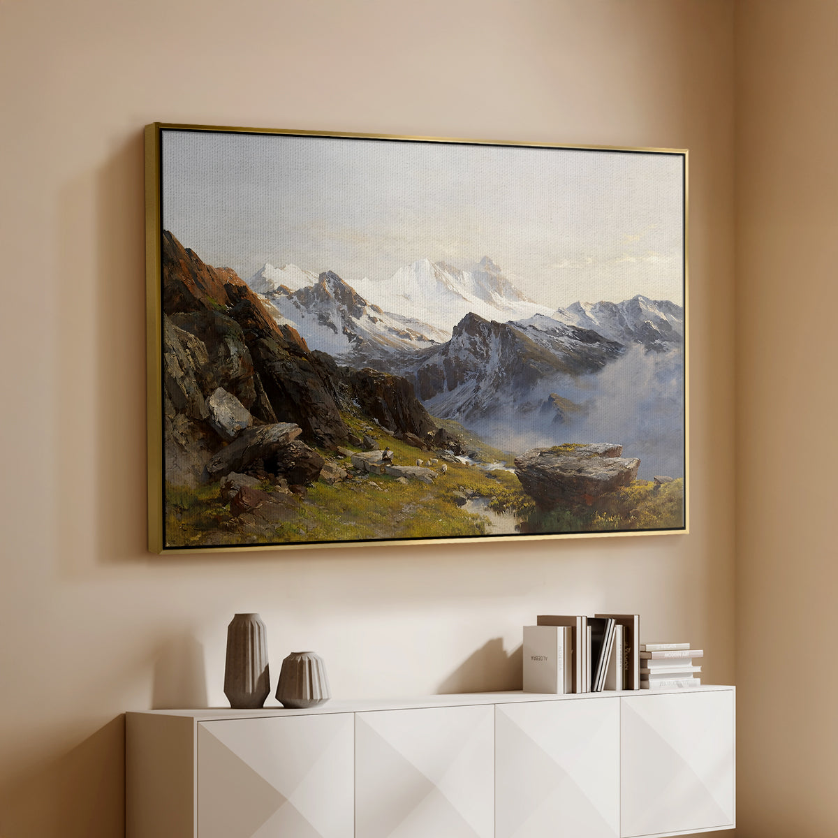 Gold floater framed canvas of The Großglockner from the Prager Hut, 1890 by Edward Theodore Compton, featuring a mountain summit seen from elevated viewpoint with surrounding landscape above a console cabinet in a minimalist entryway.