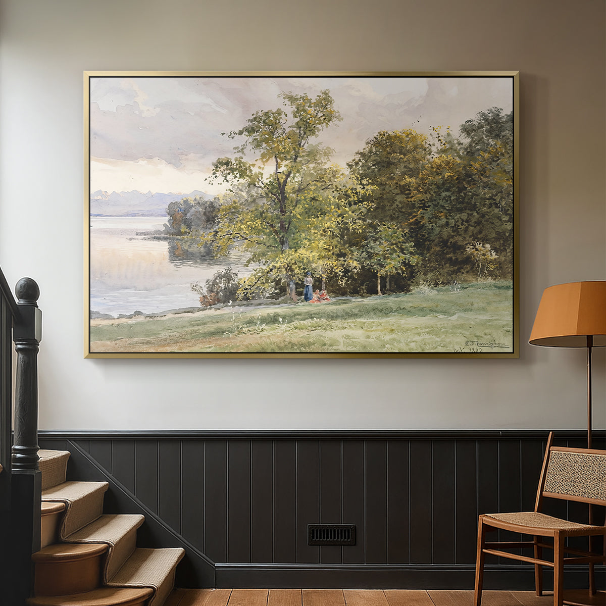 Gold floater framed canvas featuring a tranquil lakeside view with soft atmospheric tones, displayed in a hallway near a staircase.