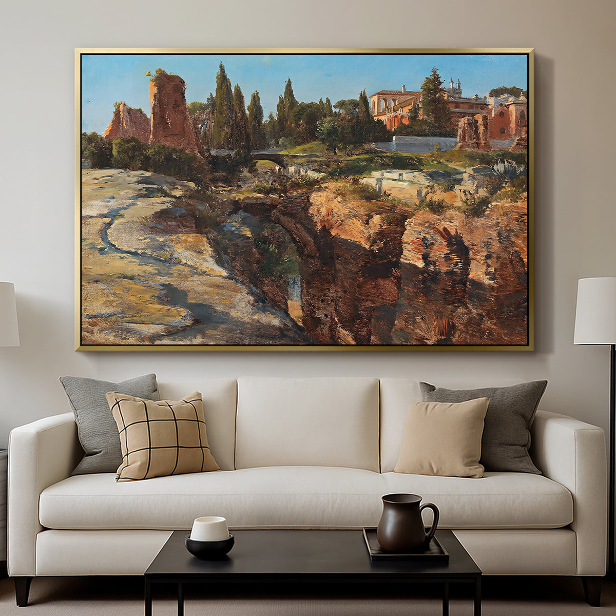 Palatine in Rome, c. 1921 by Edward Theodore Compton displayed in a gold floater framed canvas above a sofa in a clean living room.