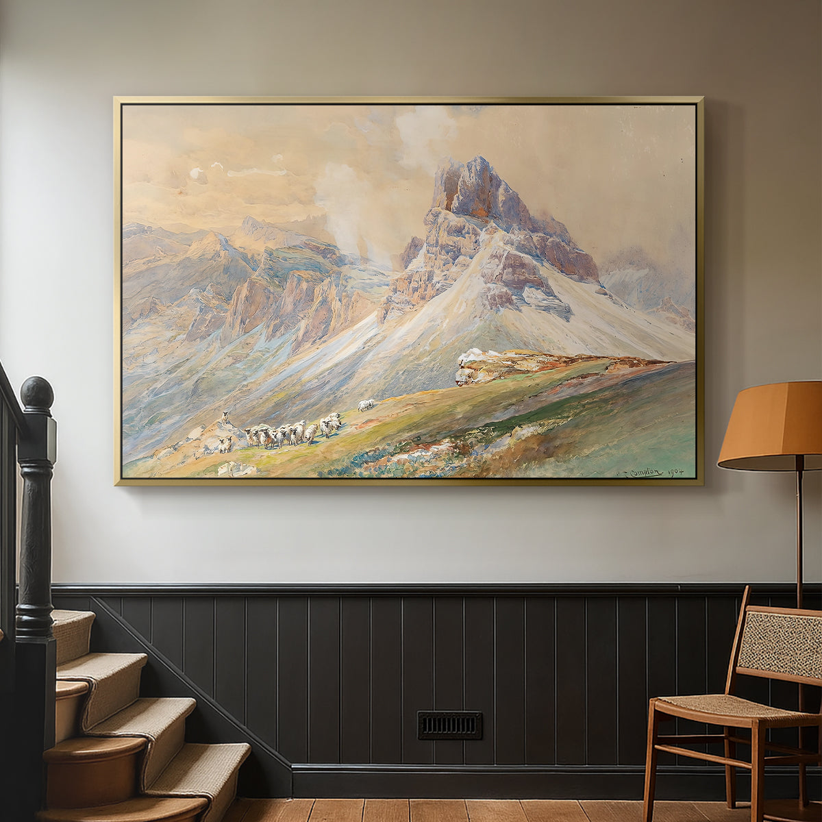 Gold floater framed canvas featuring a realistic mountain view with strong geological forms, displayed in a hallway near a staircase.