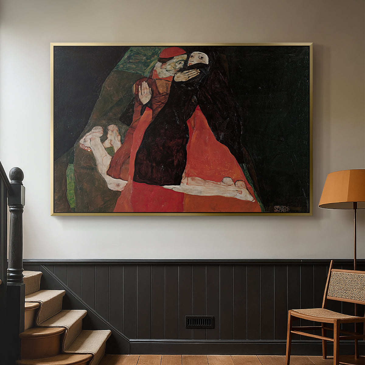 Gold floater framed canvas featuring an intimate scene with religious figures in modernist style, displayed in a hallway near a staircase.