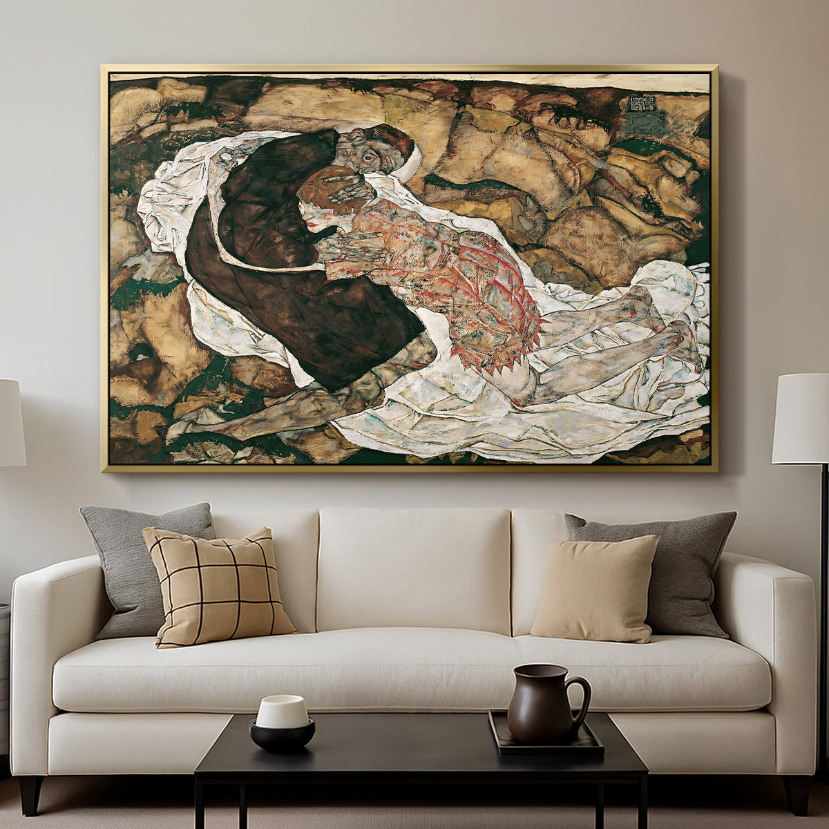 Death and the Maiden, 1915 by Egon Schiele displayed in a gold floater framed canvas above a sofa in a clean living room.