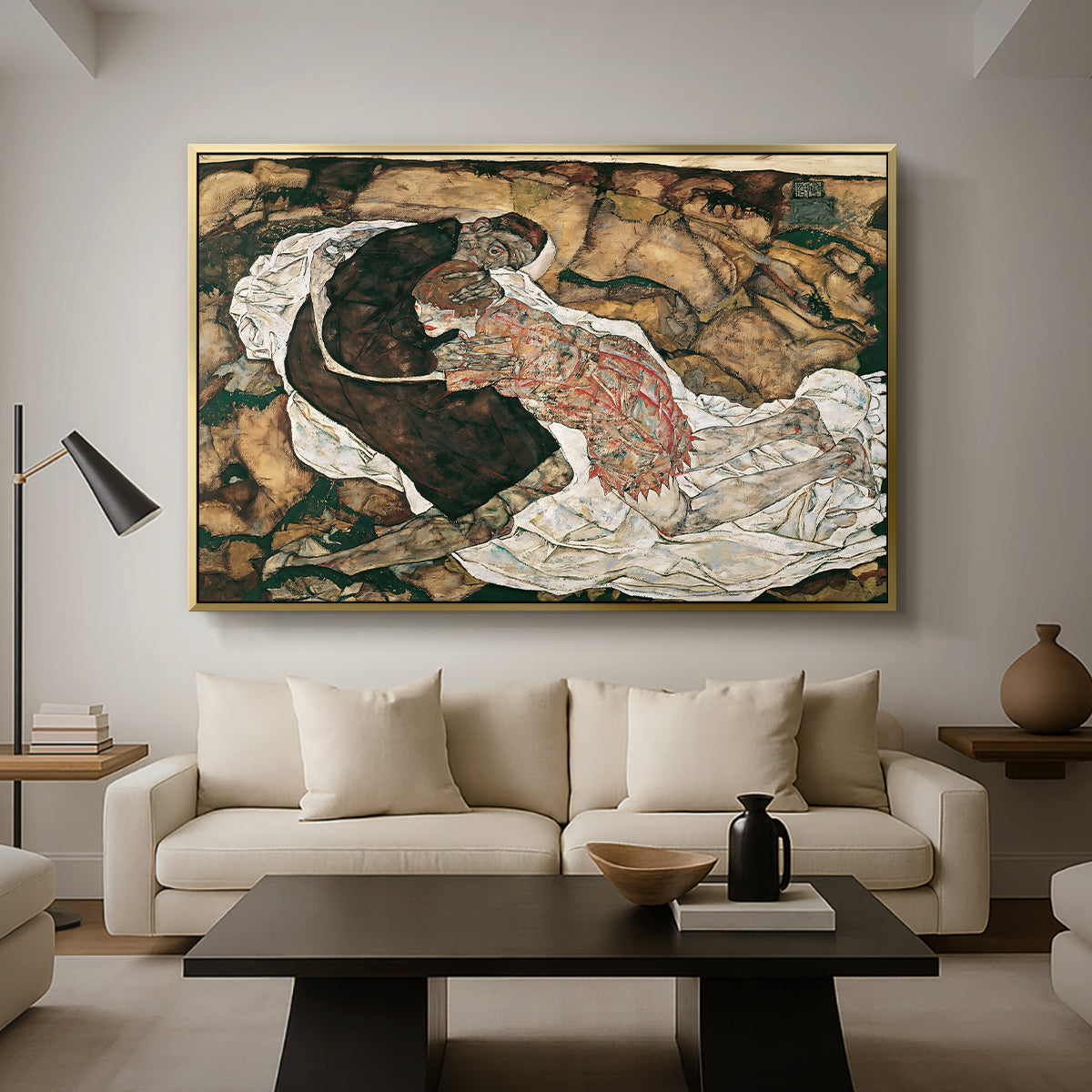 Death and the Maiden, 1915 by Egon Schiele as a gold floater framed canvas featuring intertwined figures representing death and woman in emotional embrace, displayed above a sofa in a modern living room.