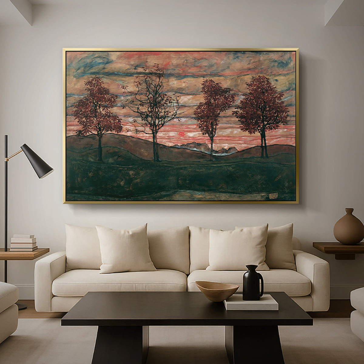 Four Trees, 1917 by Egon Schiele as a gold floater framed canvas featuring four trees standing in open landscape against colorful sky, displayed above a sofa in a modern living room.