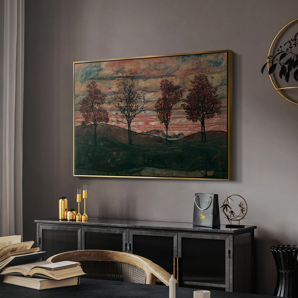 Four Trees, 1917 by Egon Schiele in a gold floater framed canvas featuring a stylized nature scene with strong outlines and simple composition, displayed above a desk in a dark home office interior.