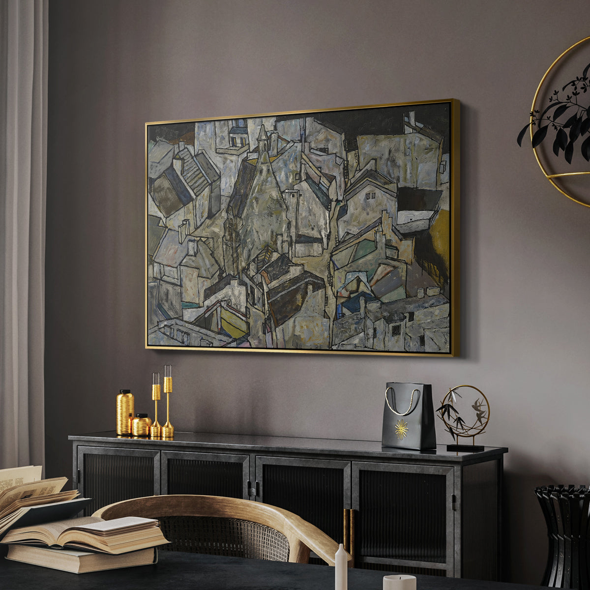 Mödling II, 1918 by Egon Schiele in a gold floater framed canvas featuring an abstracted town view with angular rooftops and fragmented forms, displayed above a desk in a dark home office interior.