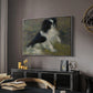Tama, the Japanese Dog, c. 1876 by Pierre-Auguste Renoir in a silver floater framed canvas featuring a close-up of a small dog in motion surrounded by rippling water, displayed above a desk in a dark home office interior.