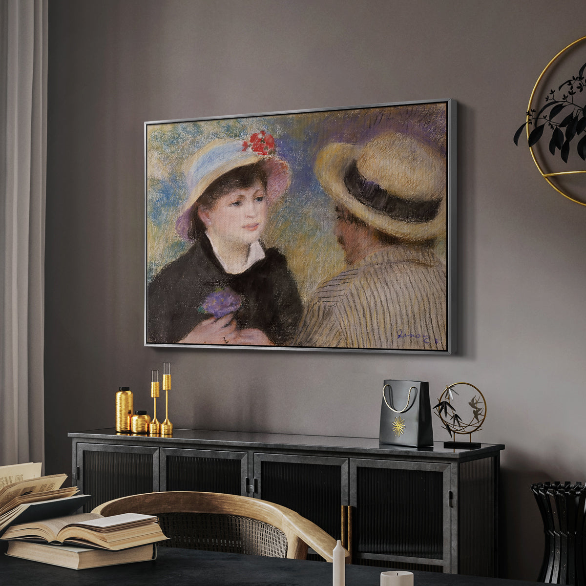 Boating Couple (Aline Charigot and Renoir), c. 1881 by Pierre-Auguste Renoir in a silver floater framed canvas featuring an impressionist depiction of couple enjoying leisure time near water, displayed above a desk in a dark home office interior.