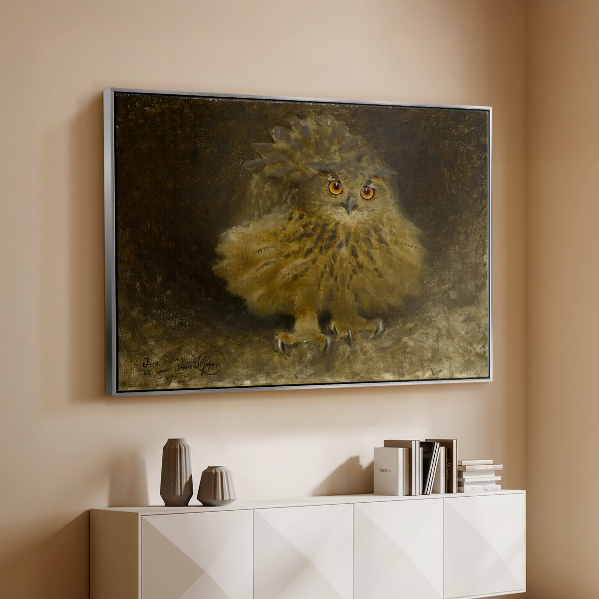 Silver floater framed canvas of An Eagle Owl (Berguv), 1905 by Bruno Liljefors, featuring a detailed wildlife painting of eagle owl with piercing eyes in darkness above a console cabinet in a minimalist entryway.