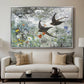 Common Swifts, 1886 by Bruno Liljefors displayed in a silver floater framed canvas above a sofa in a clean living room.