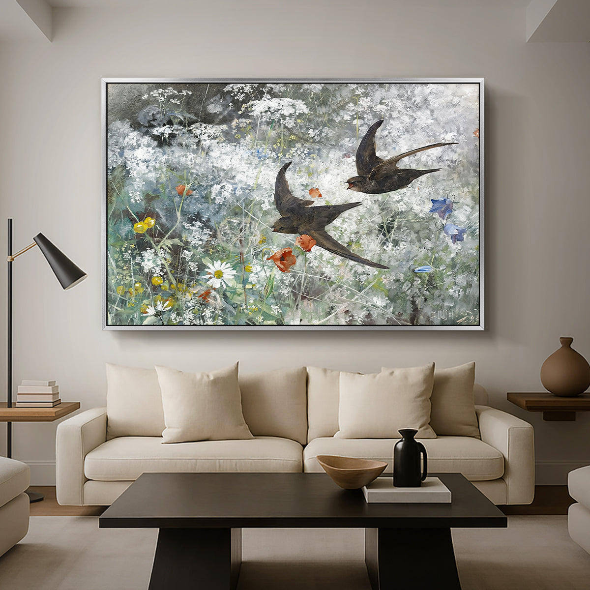 Common Swifts, 1886 by Bruno Liljefors as a silver floater framed canvas featuring a flock of birds in flight soaring across open sky above landscape, displayed above a sofa in a modern living room.