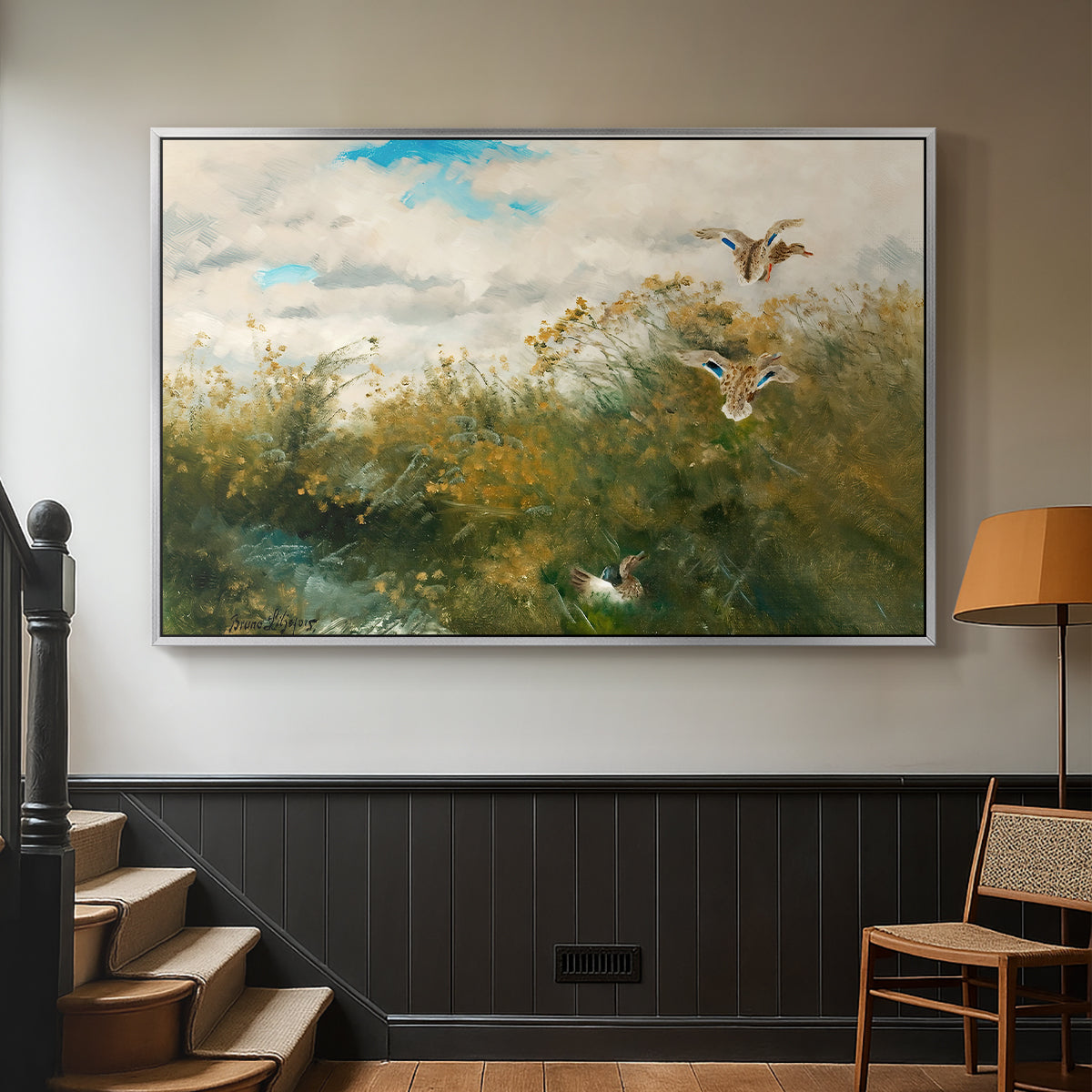 Silver floater framed canvas featuring a realistic depiction of ducks in countryside landscape, displayed in a hallway near a staircase.