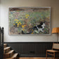 Silver floater framed canvas featuring a naturalistic depiction of cat in blooming countryside setting, displayed in a hallway near a staircase.