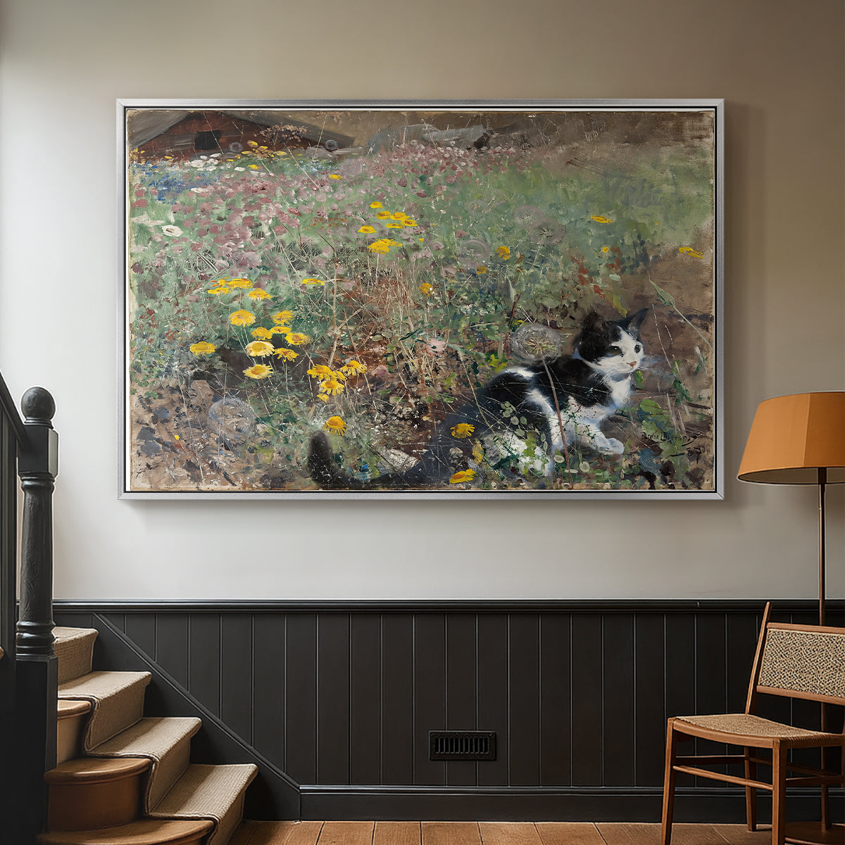 Silver floater framed canvas featuring a naturalistic depiction of cat in blooming countryside setting, displayed in a hallway near a staircase.