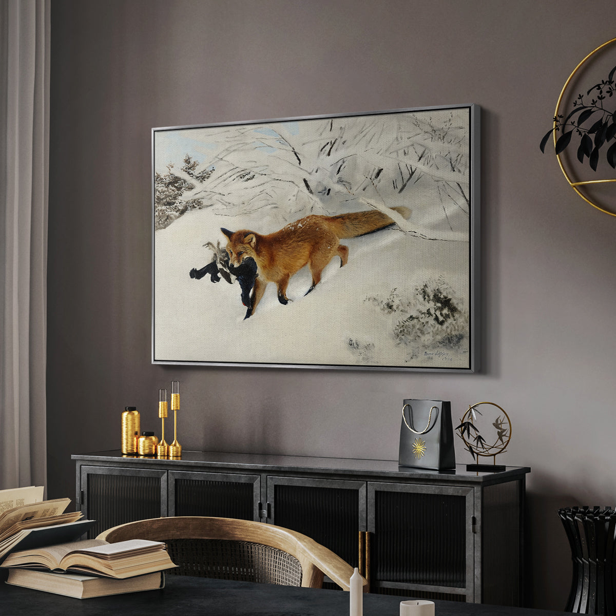 Fox in Snow Landscape, 1900 by Bruno Liljefors in a silver floater framed canvas featuring a red fox crossing snow-covered ground under pale sky, displayed above a desk in a dark home office interior.