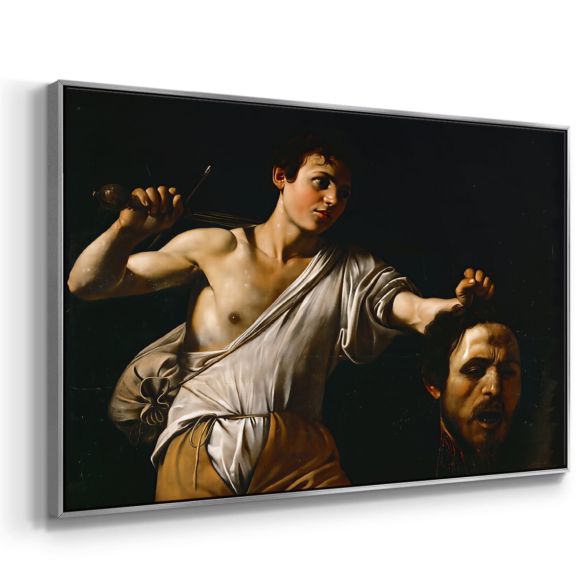 Angled view of David with the Head of Goliath (Vienna Version), c. 1607 by Caravaggio in a silver floater framed canvas.