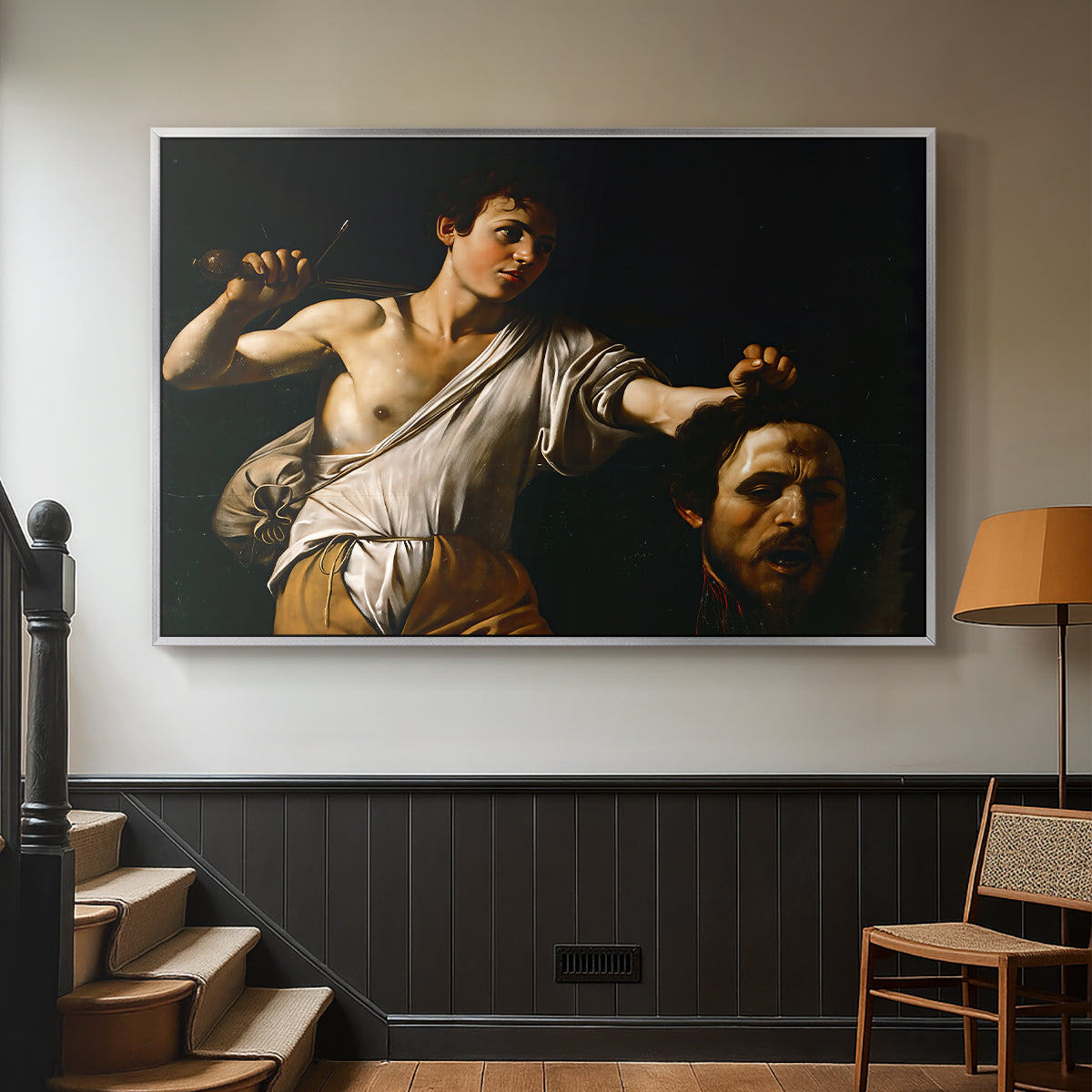 Silver floater framed canvas featuring an intense religious scene with figure emerging from darkness holding trophy, displayed in a hallway near a staircase.