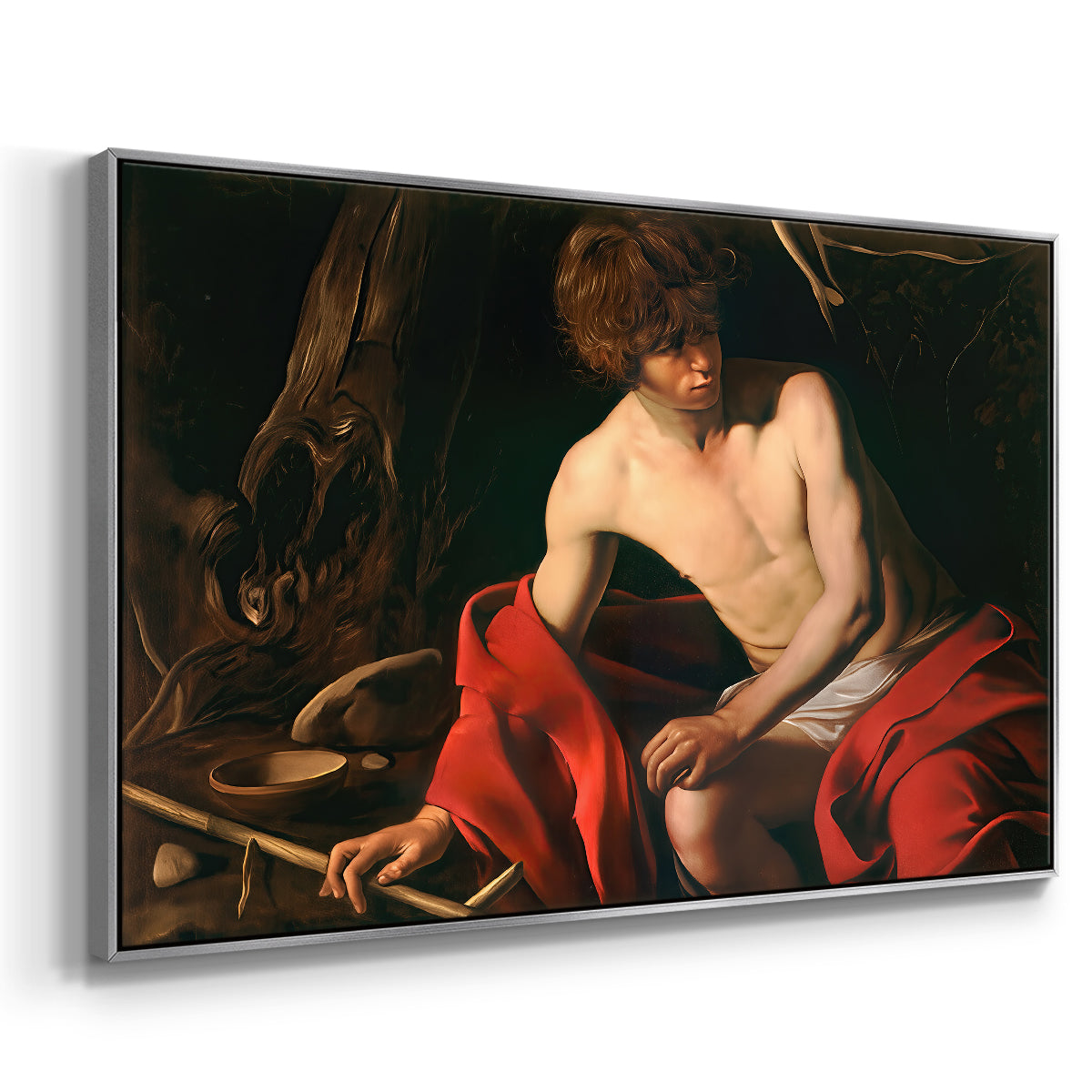 Angled view of Saint John the Baptist in the Wilderness, c. 1603-1604 by Caravaggio in a silver floater framed canvas.