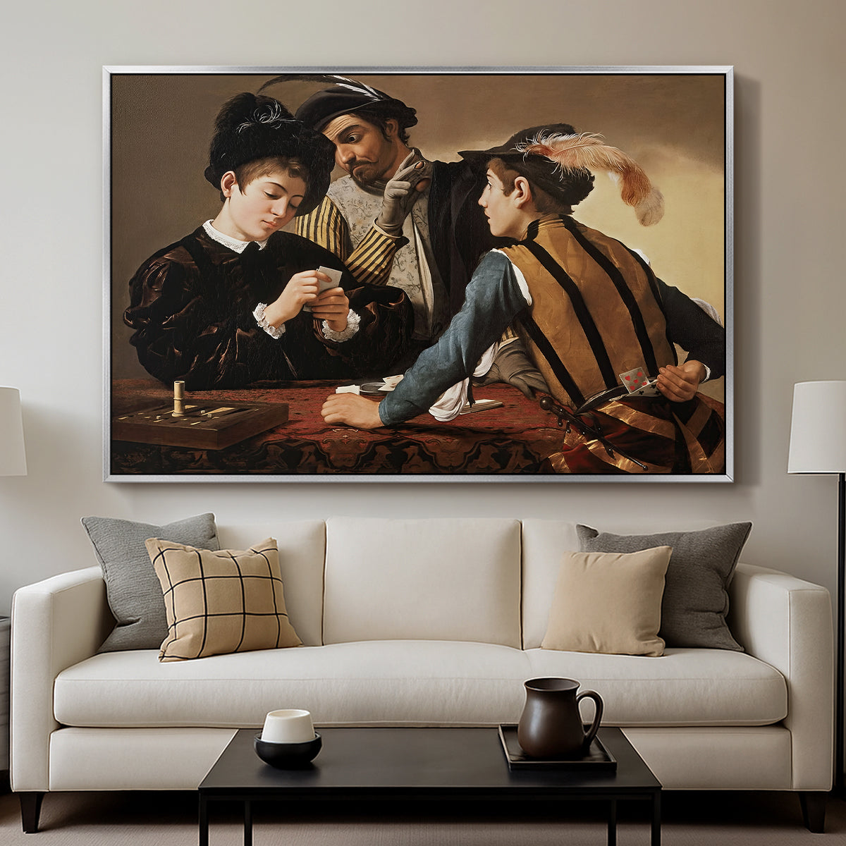 The Cardsharps, c. 1594 by Caravaggio displayed in a silver floater framed canvas above a sofa in a clean living room.