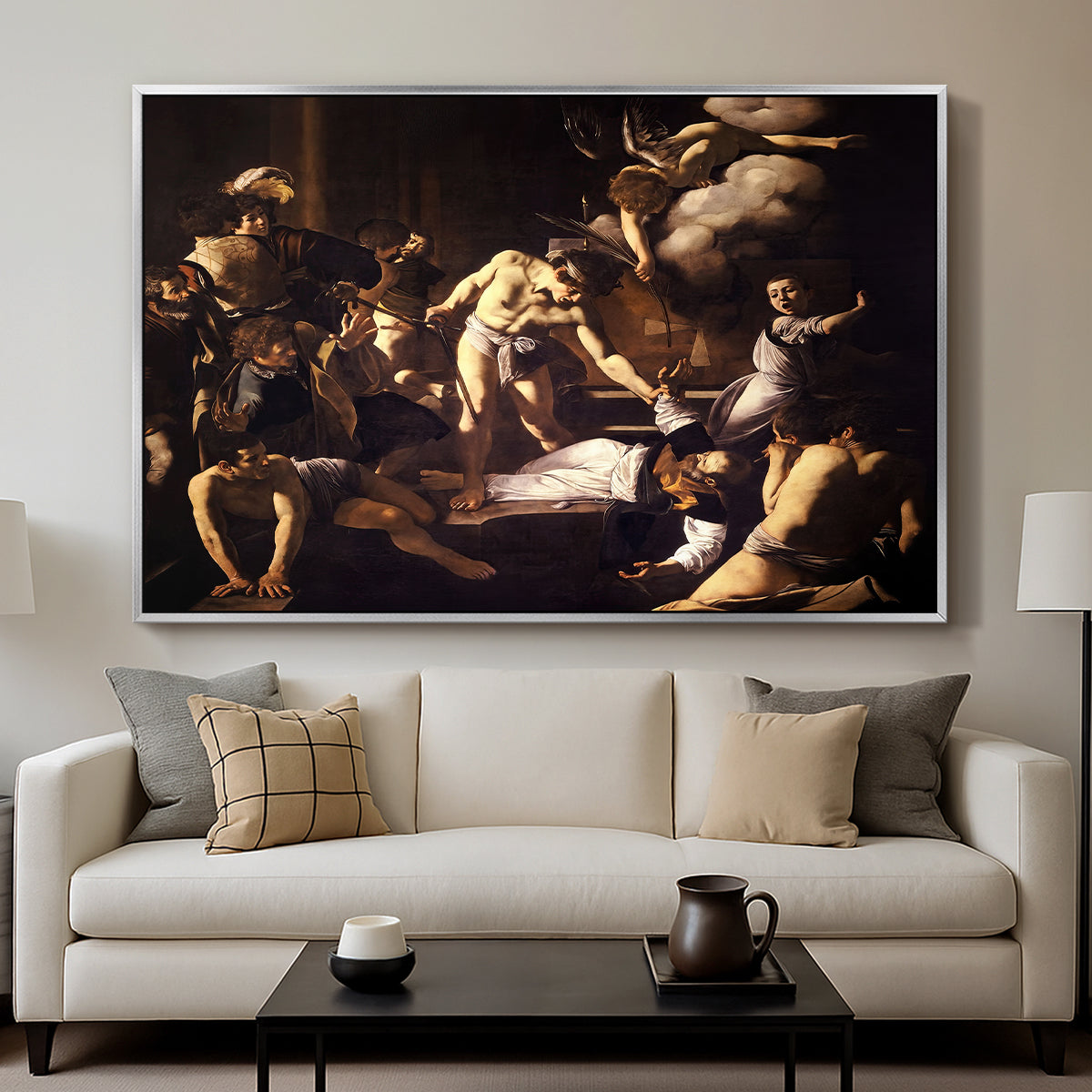 The Martyrdom of Saint Matthew, 1599-1600 by Caravaggio displayed in a silver floater framed canvas above a sofa in a clean living room.