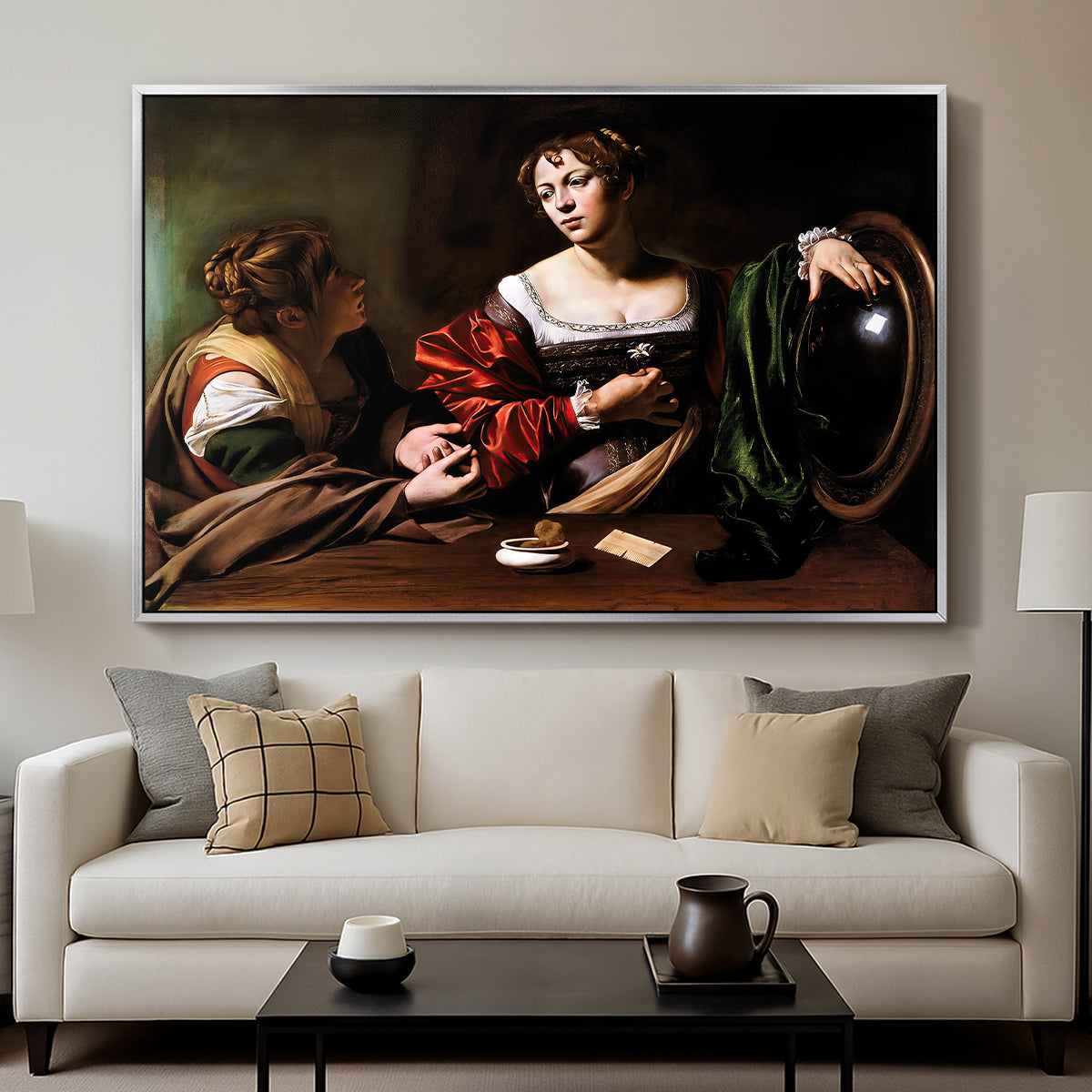 Martha and Mary Magdalene, c. 1598 by Caravaggio displayed in a silver floater framed canvas above a sofa in a clean living room.