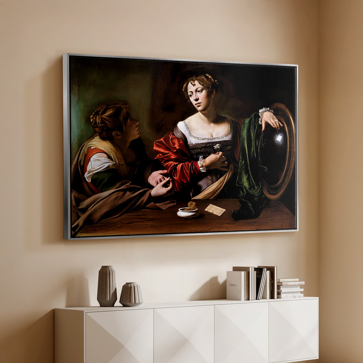 Silver floater framed canvas of Martha and Mary Magdalene, c. 1598 by Caravaggio, featuring a biblical scene of Martha speaking to Mary Magdalene indoors above a console cabinet in a minimalist entryway.