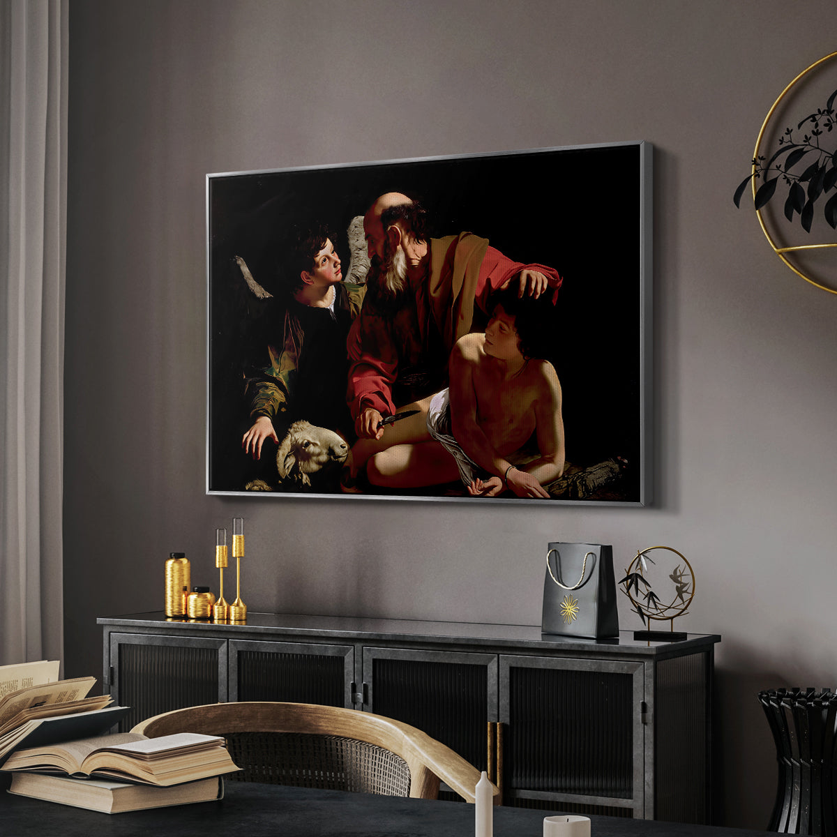 The Sacrifice of Isaac (Uffizi Version), c. 1603 by Caravaggio in a silver floater framed canvas featuring a dramatic moment of divine intervention during sacrifice of Isaac, displayed above a desk in a dark home office interior.