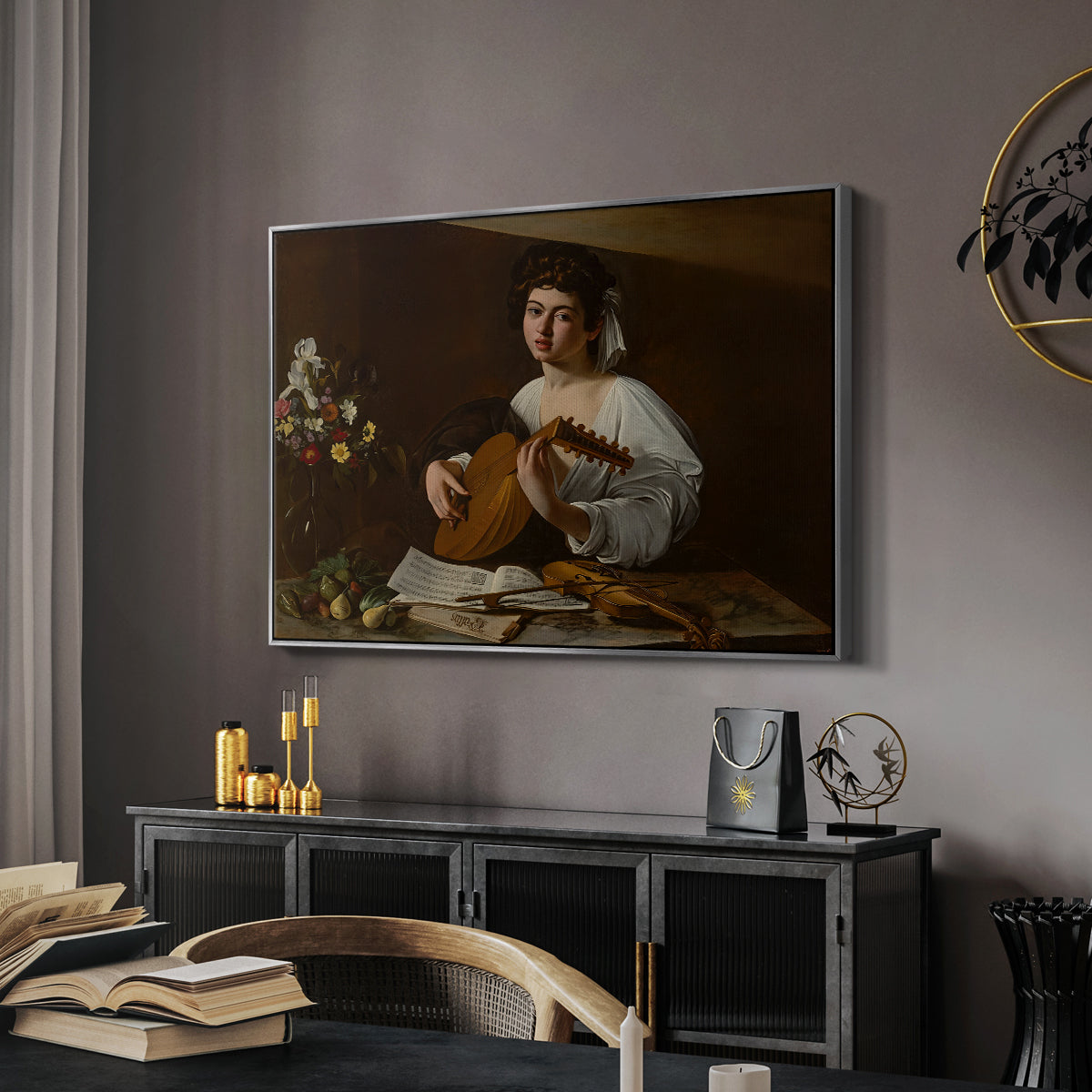 The Lute Player (Hermitage Version), c. 1596 by Caravaggio in a silver floater framed canvas featuring an intimate musical scene with instrument and decorative objects, displayed above a desk in a dark home office interior.