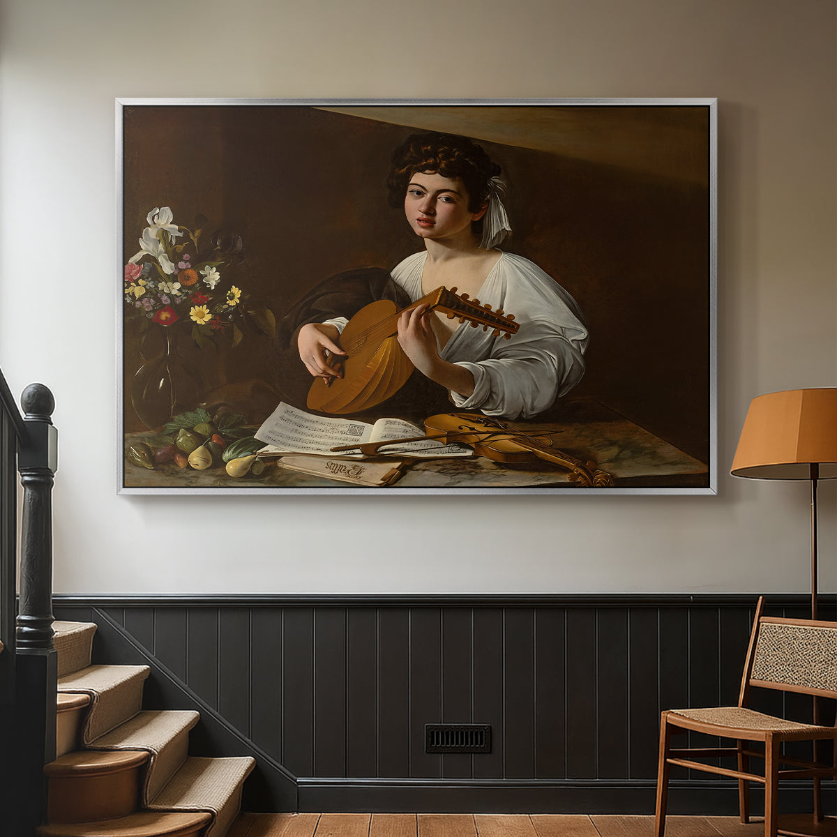 Silver floater framed canvas featuring a Baroque depiction of musician with detailed textures and lighting, displayed in a hallway near a staircase.