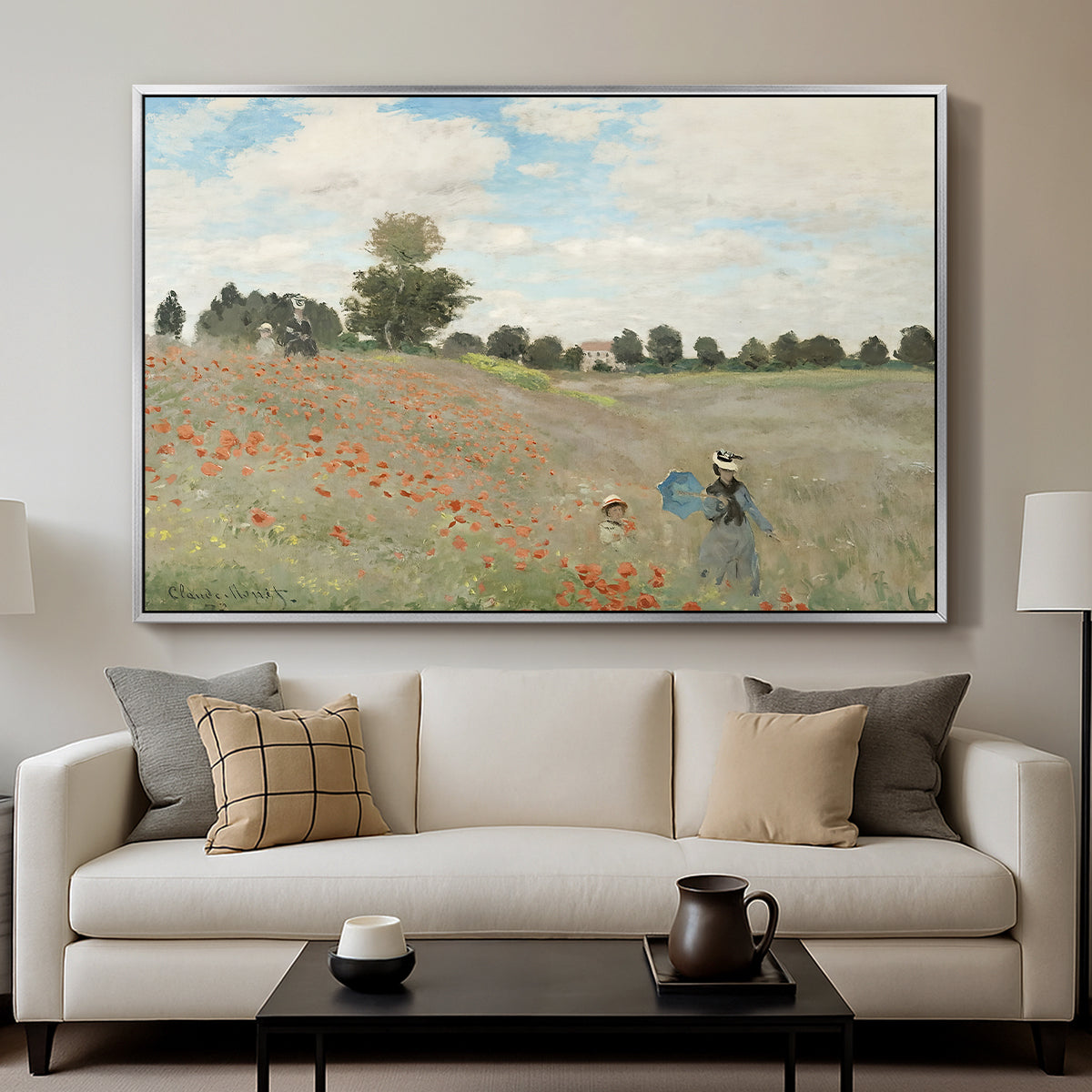 The Poppy Field near Argenteuil, 1873 by Claude Monet displayed in a silver floater framed canvas above a sofa in a clean living room.