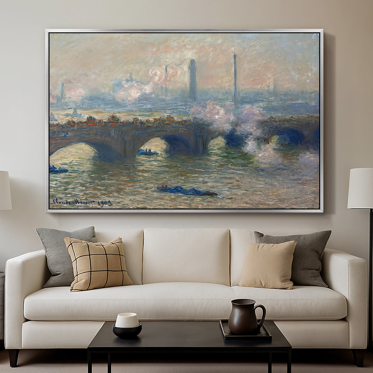 Waterloo Bridge, Gray Day, 1903 by Claude Monet displayed in a silver floater framed canvas above a sofa in a clean living room.