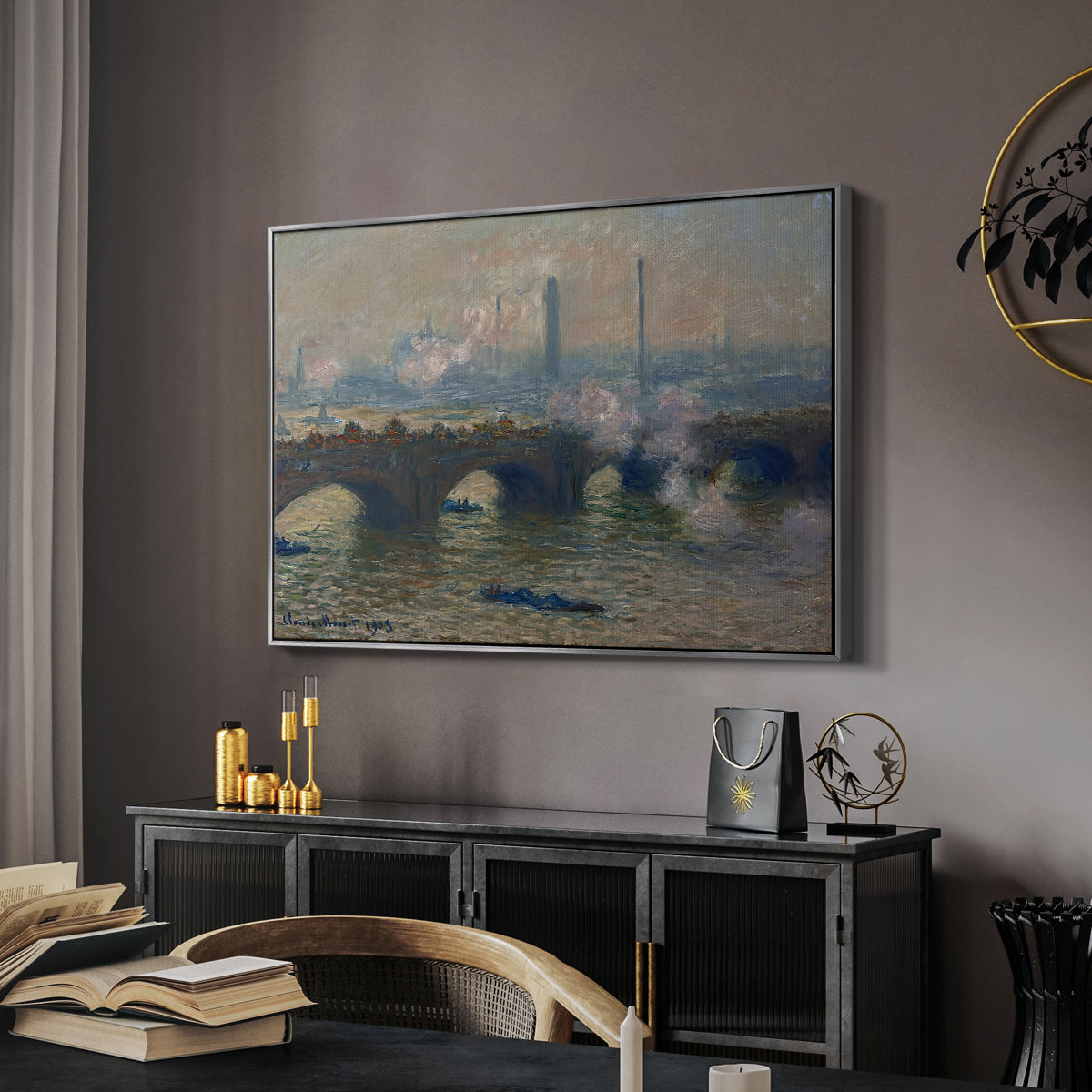 Waterloo Bridge, Gray Day, 1903 by Claude Monet in a silver floater framed canvas featuring a river and bridge scene with diffused light and urban backdrop, displayed above a desk in a dark home office interior.