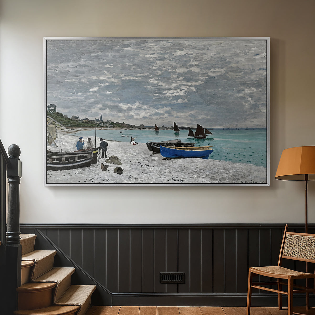 Silver floater framed canvas featuring an impressionist seaside gathering with flags and ocean view, displayed in a hallway near a staircase.