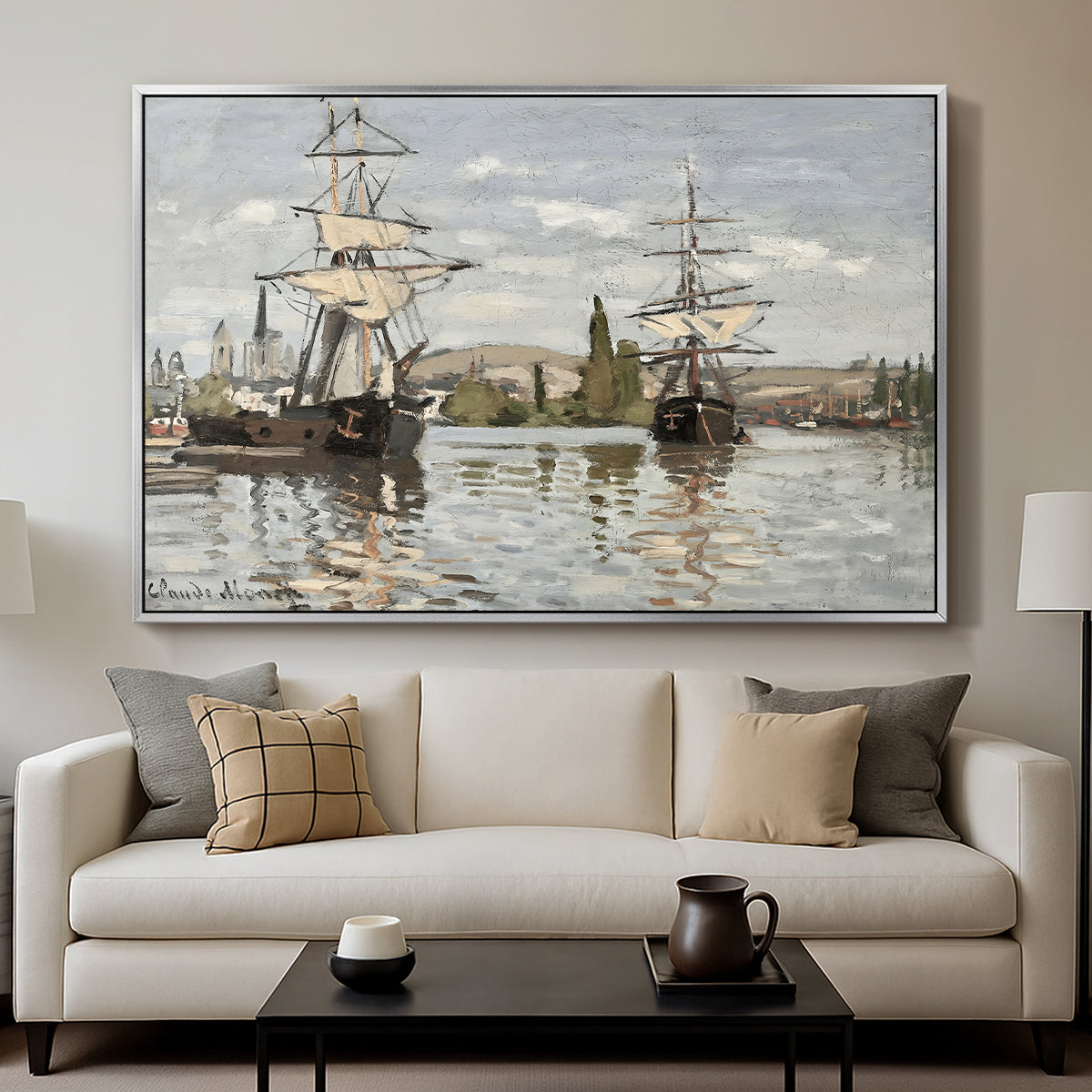 Ships Riding on the Seine at Rouen, 1872 by Claude Monet displayed in a silver floater framed canvas above a sofa in a clean living room.