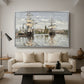 Ships Riding on the Seine at Rouen, 1872 by Claude Monet as a silver floater framed canvas featuring large ships docked along the Seine with masts rising against soft sky, displayed above a sofa in a modern living room.