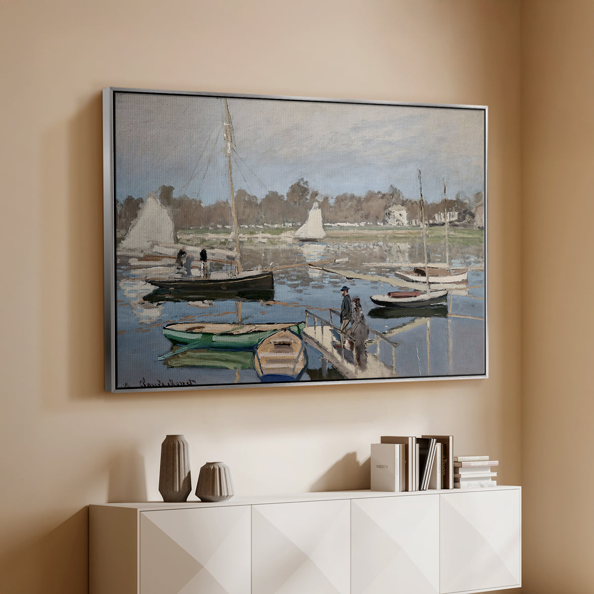 Silver floater framed canvas of The Basin at Argenteuil, 1874 by Claude Monet, featuring an impressionist boating scene with clustered masts and gentle ripples above a console cabinet in a minimalist entryway.